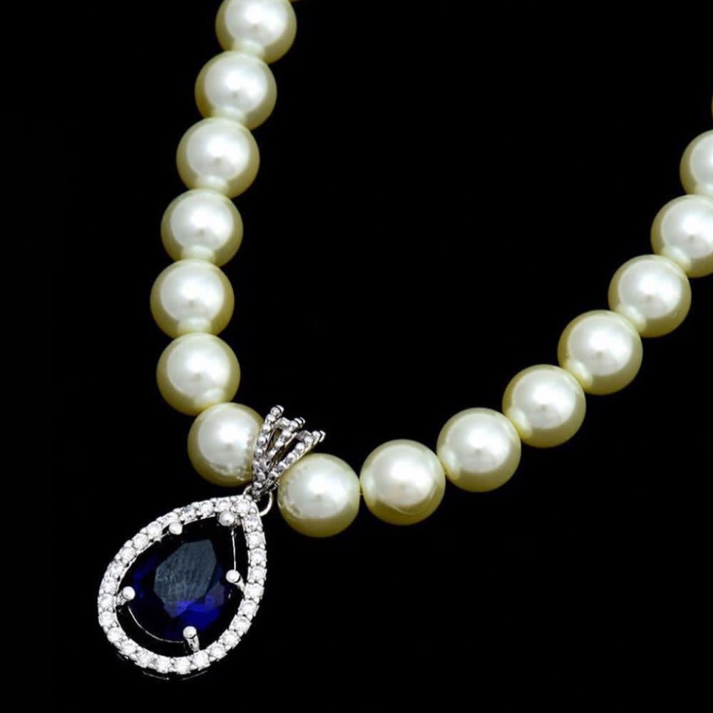 Sapphire and pearl set earrings and necklace